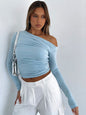 Off-shoulder long-sleeved gathered midriff-baring knit top